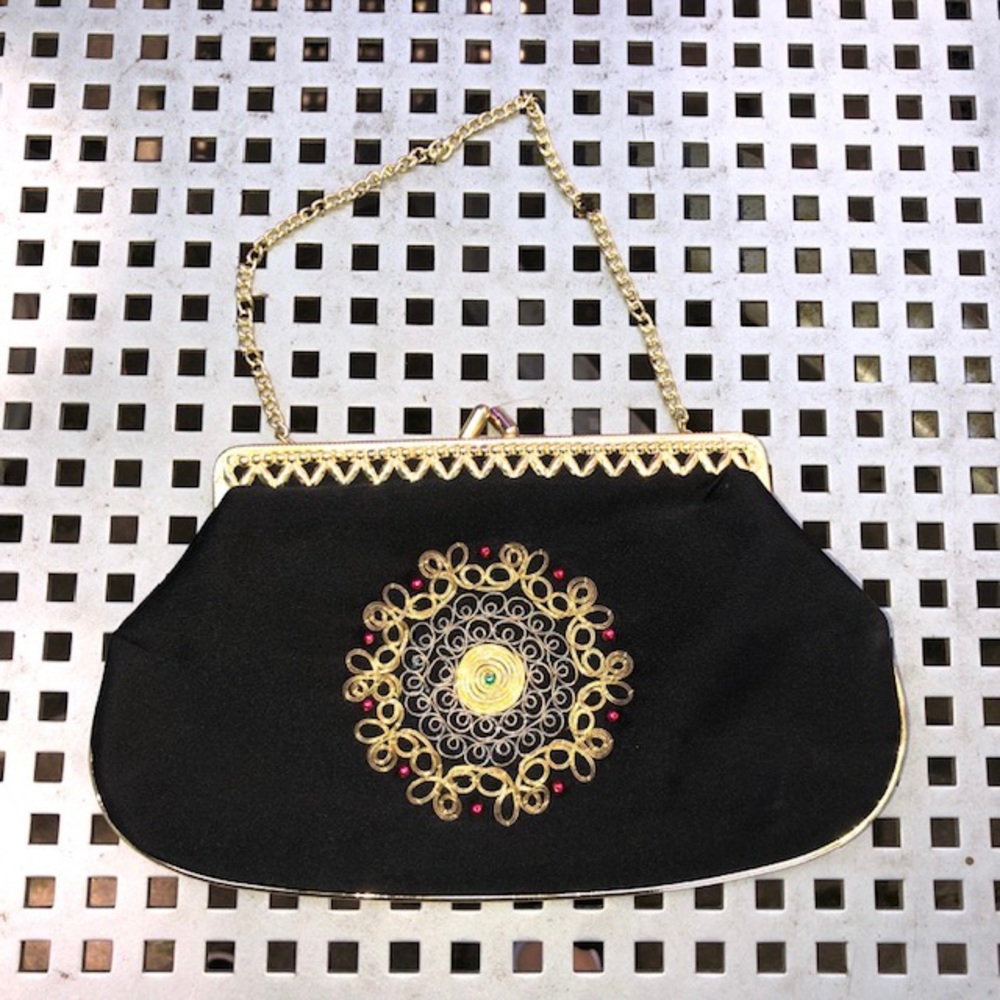 Black gold clutch bag with design